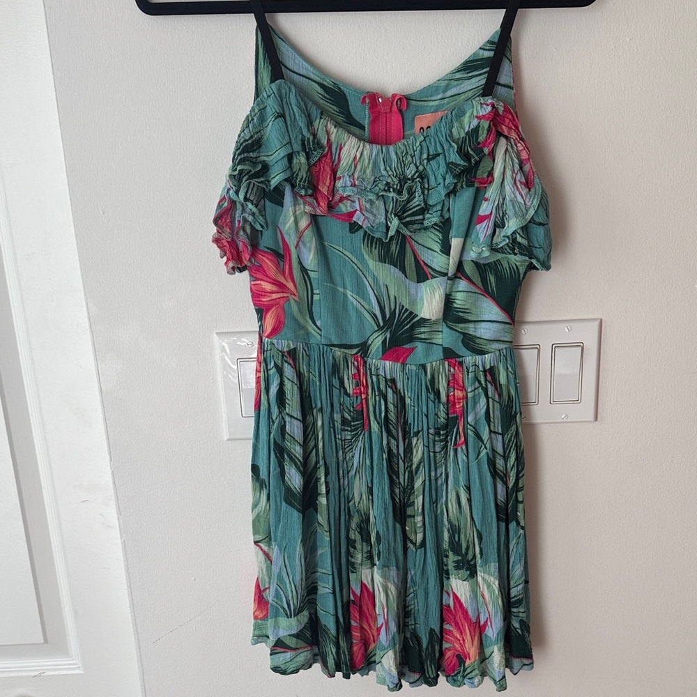 A Classic Paradise Tropical Dress with ruffle top adjustable straps and pockets